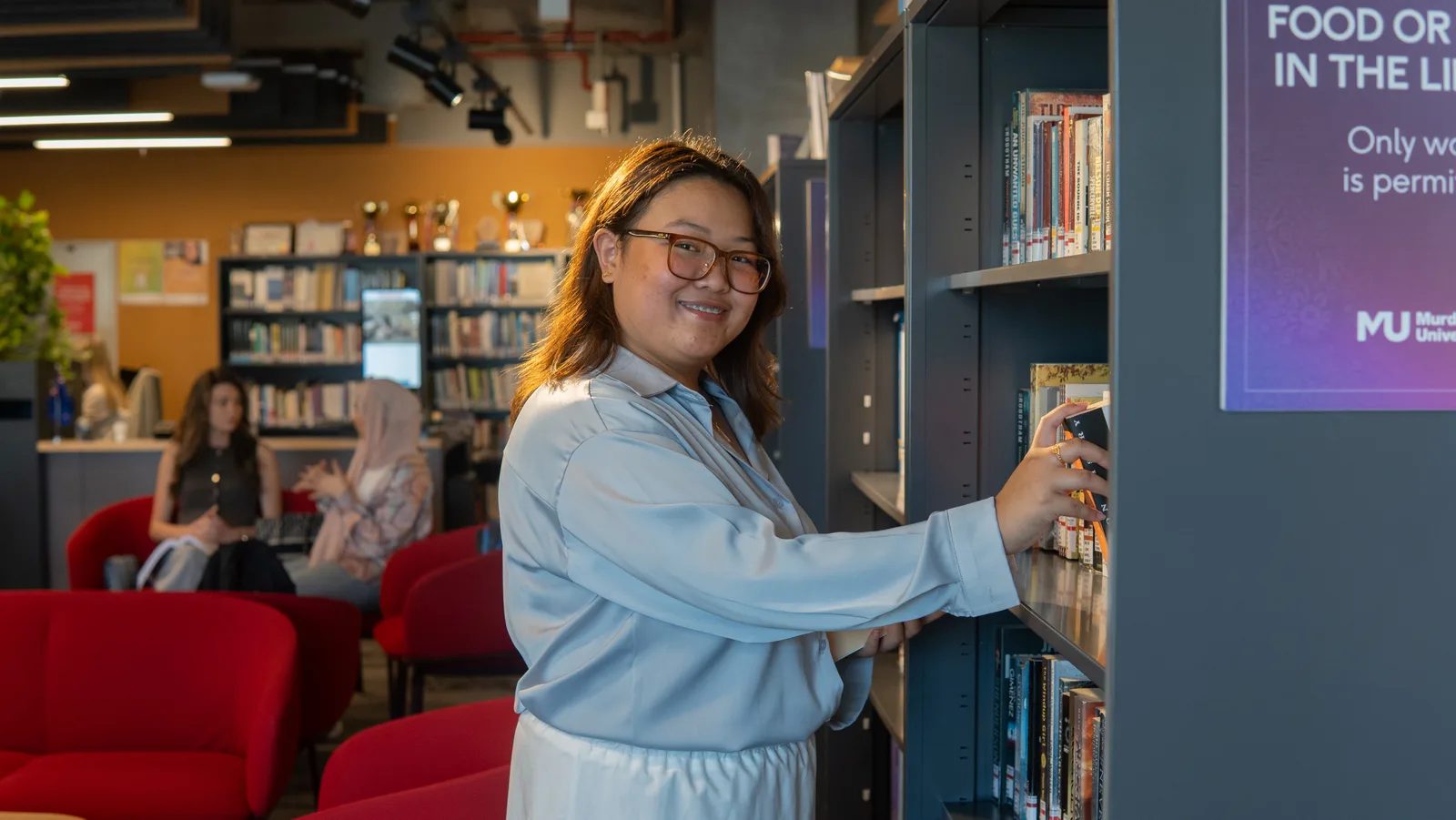 A Murdoch University Dubai student in the campus library